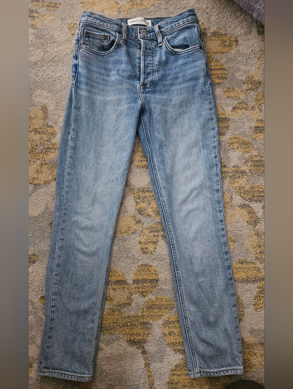 Denim Forum The Yoko High Rise Slim in a medium-light indigo. 25